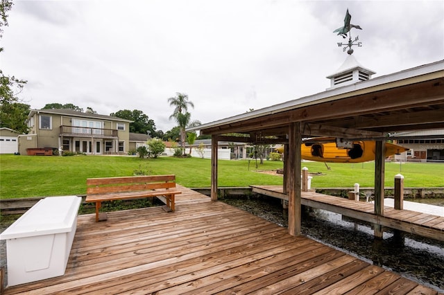 view of dock with a yard