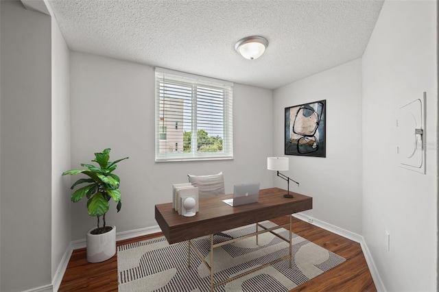 office space with dark hardwood / wood-style flooring and a textured ceiling