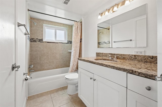 full bathroom featuring tile patterned floors, vanity, shower / bath combo, and toilet