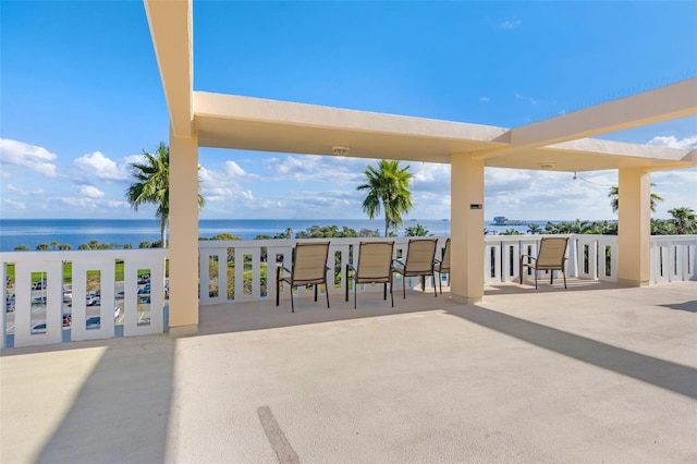 view of patio with a water view