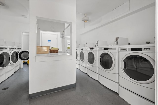 clothes washing area with separate washer and dryer