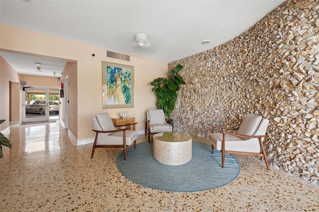 sitting room with a textured ceiling