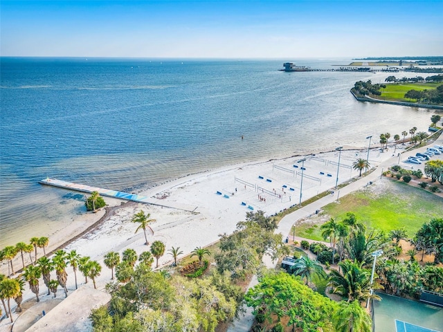 birds eye view of property with a beach view and a water view