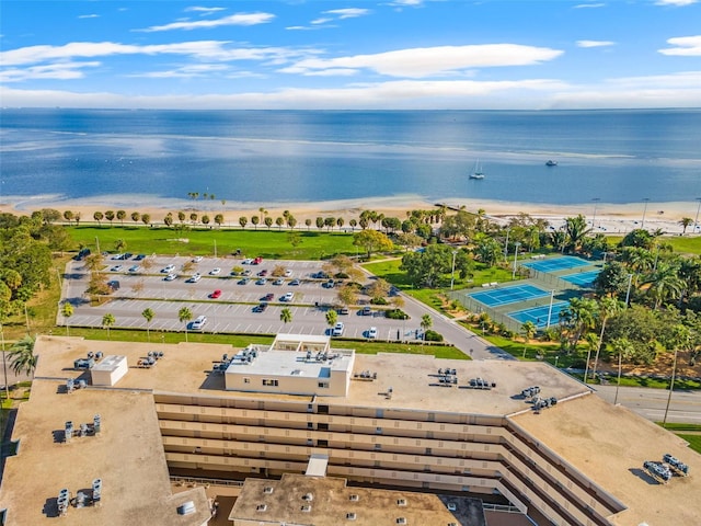 drone / aerial view with a water view and a view of the beach