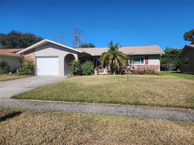 ranch-style house with a garage and a front yard