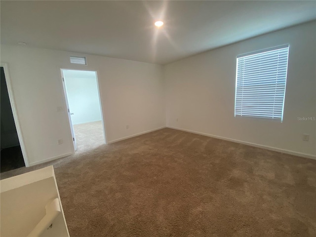 empty room featuring carpet floors