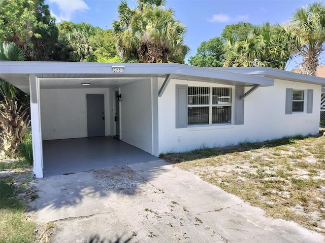 view of front of house with a carport