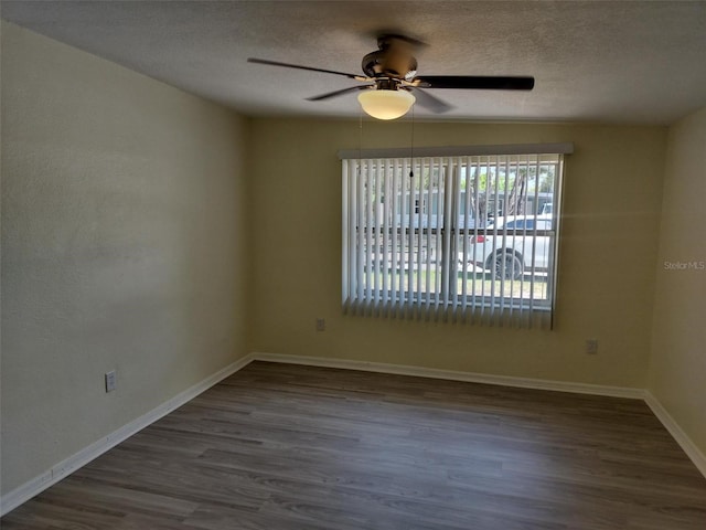 empty room with a textured ceiling, ceiling fan, and hardwood / wood-style floors