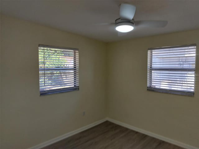 empty room with hardwood / wood-style flooring and ceiling fan