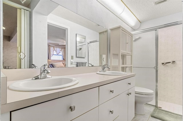 ensuite bathroom featuring a stall shower, a sink, and ensuite bath