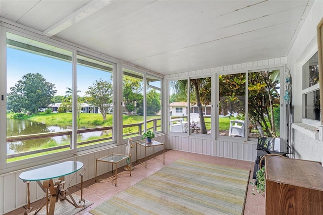 sunroom with a water view