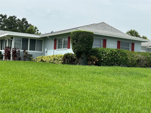 view of home's exterior with a yard