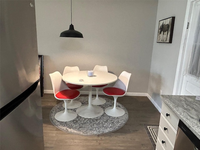 dining space featuring dark hardwood / wood-style flooring