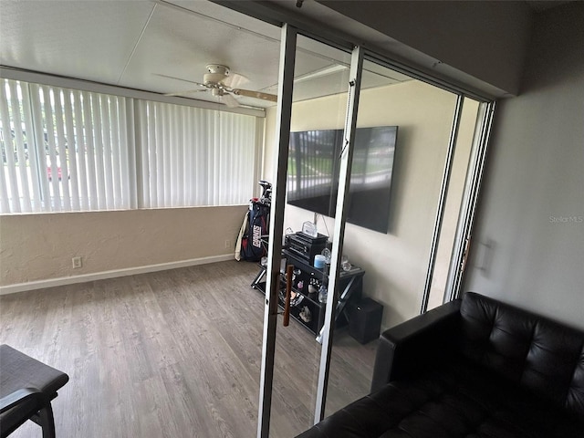 sunroom / solarium with ceiling fan