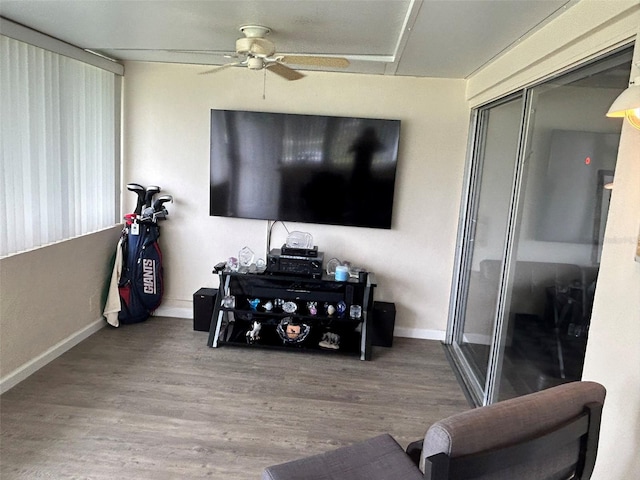 living room with ceiling fan and hardwood / wood-style floors