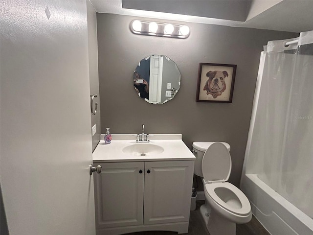 full bathroom featuring vanity, shower / bath combo, and toilet