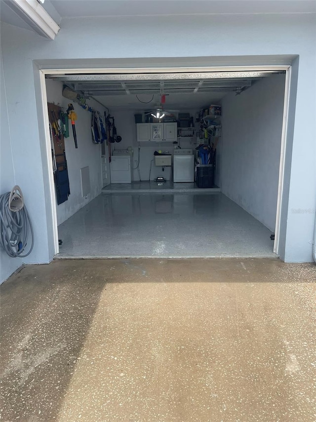 garage featuring sink and washer / clothes dryer