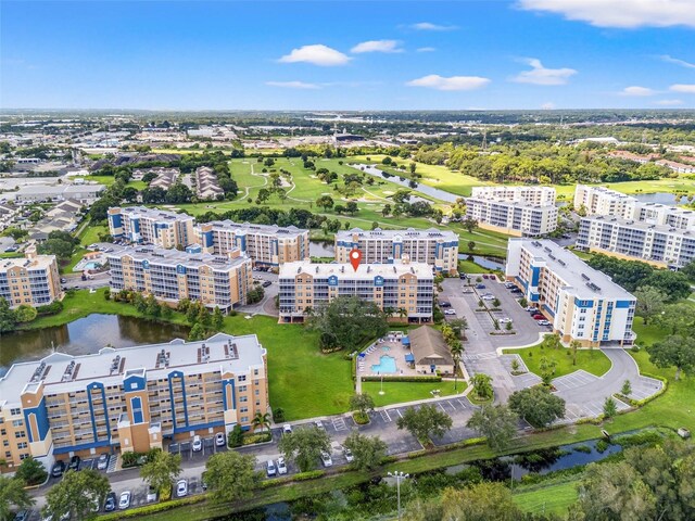 drone / aerial view with a view of city and a water view