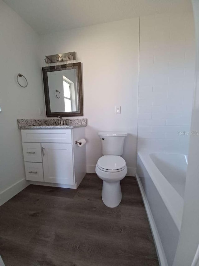 full bathroom featuring shower / bathtub combination, toilet, vanity, and hardwood / wood-style floors