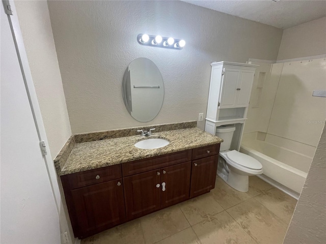 full bathroom featuring vanity, bathing tub / shower combination, and toilet