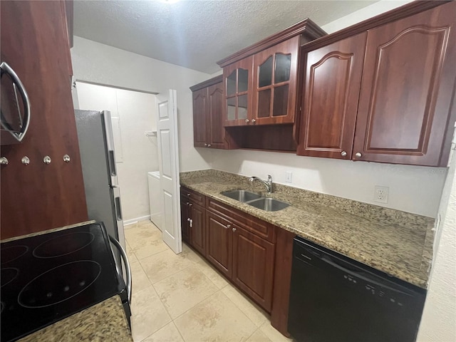 kitchen featuring sink, light stone counters, electric range, stainless steel refrigerator, and black dishwasher