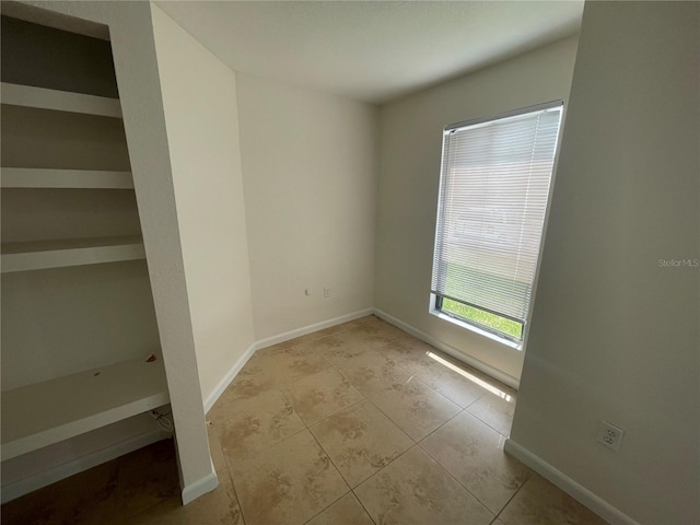 empty room with light tile patterned floors