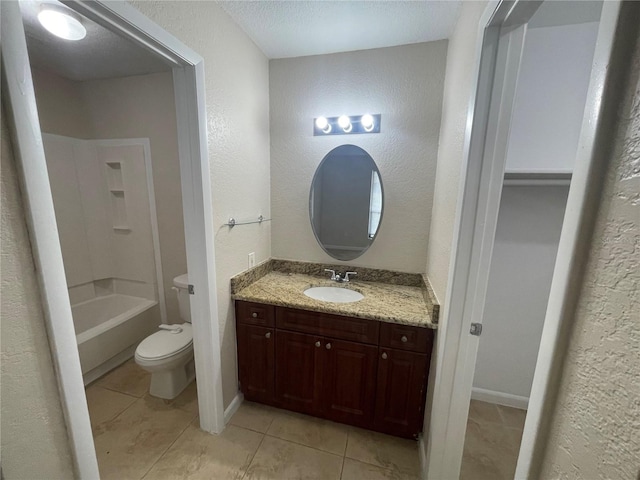 full bathroom featuring washtub / shower combination, tile patterned floors, toilet, a textured ceiling, and vanity