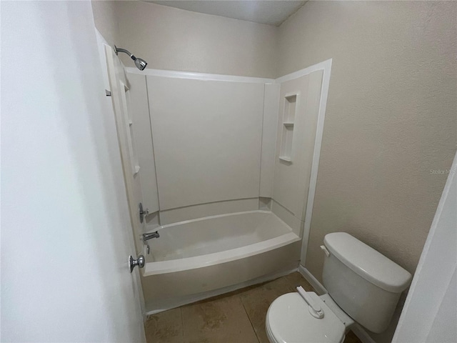 bathroom featuring tile patterned floors, toilet, and shower / bath combination