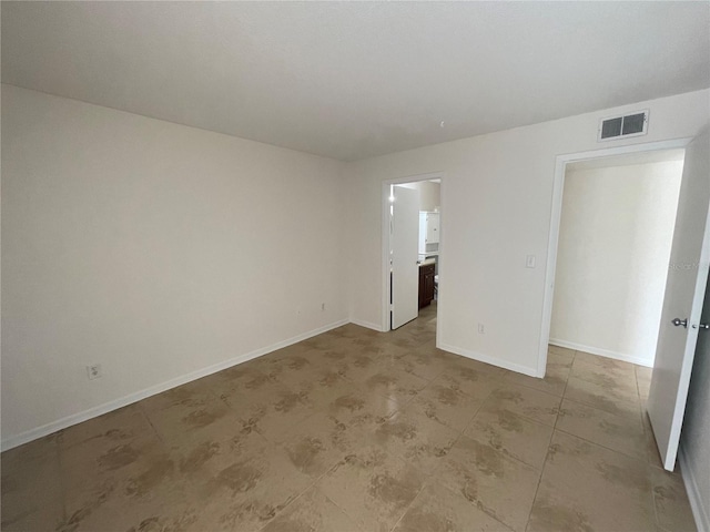 unfurnished bedroom featuring ensuite bath