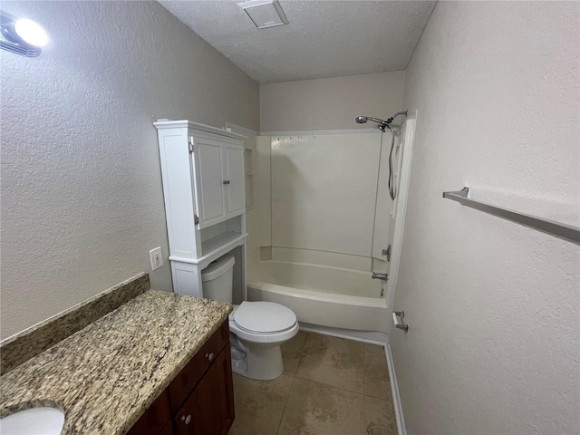 full bathroom with bathing tub / shower combination, vanity, a textured ceiling, tile patterned floors, and toilet