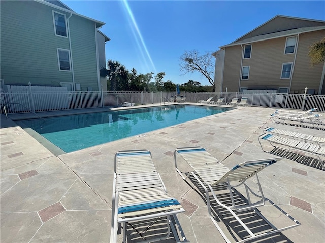 view of pool featuring a patio