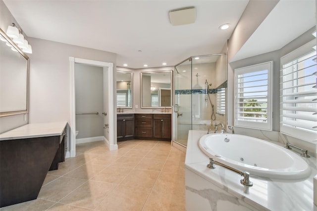 bathroom with vanity, tile patterned floors, and separate shower and tub