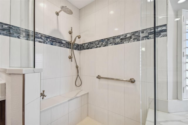 bathroom with a tile shower