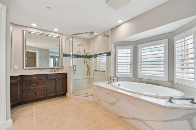 bathroom with vanity, tile patterned floors, and separate shower and tub