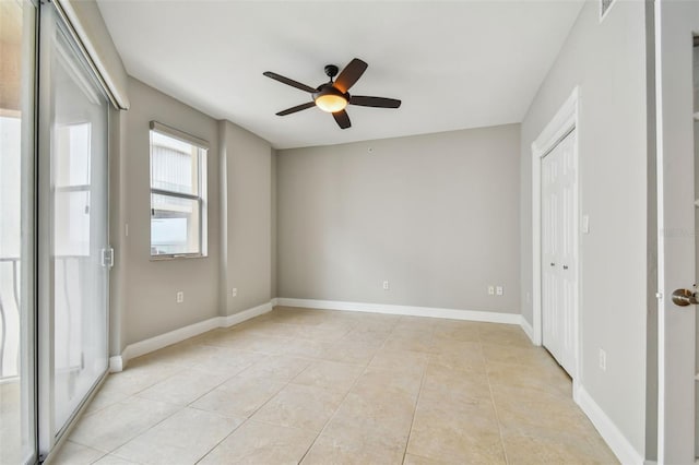 unfurnished bedroom with light tile patterned floors and ceiling fan