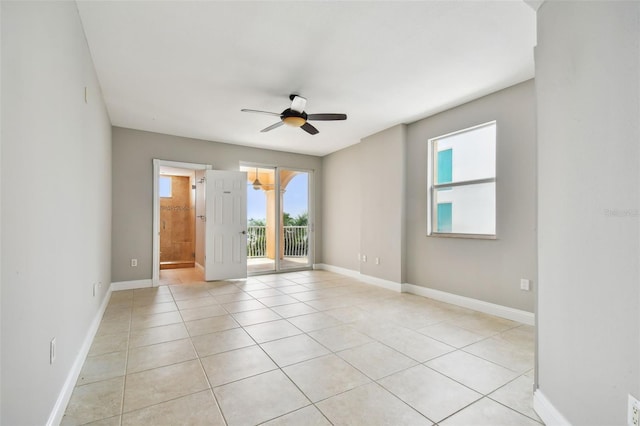 unfurnished room featuring ceiling fan and light tile patterned floors