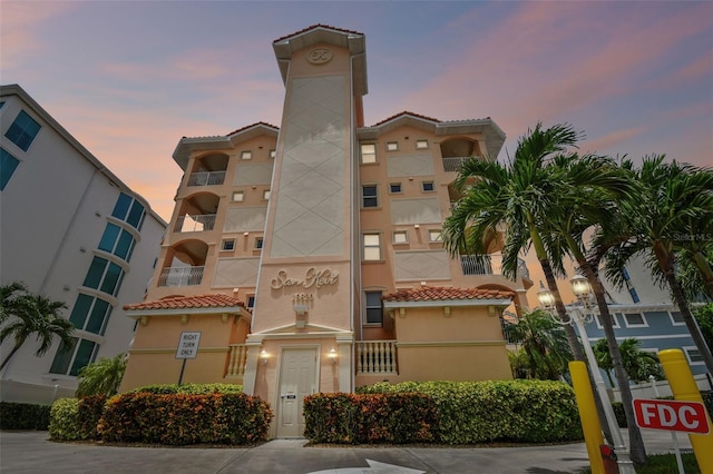 view of outdoor building at dusk