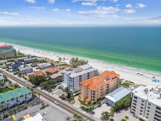 birds eye view of property featuring a view of the beach and a water view