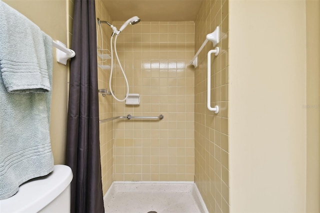 bathroom with curtained shower and toilet