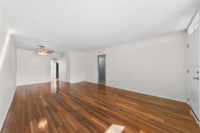 unfurnished living room featuring a ceiling fan and wood finished floors