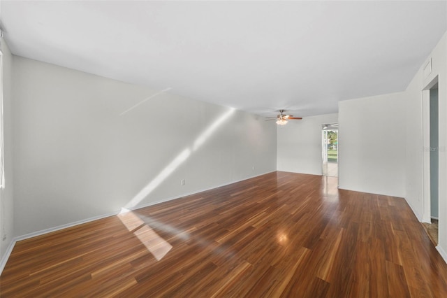 unfurnished living room with visible vents, ceiling fan, and wood finished floors