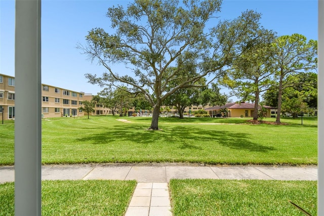 view of home's community with a lawn