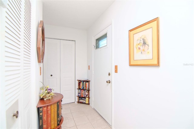 hallway with light tile patterned flooring