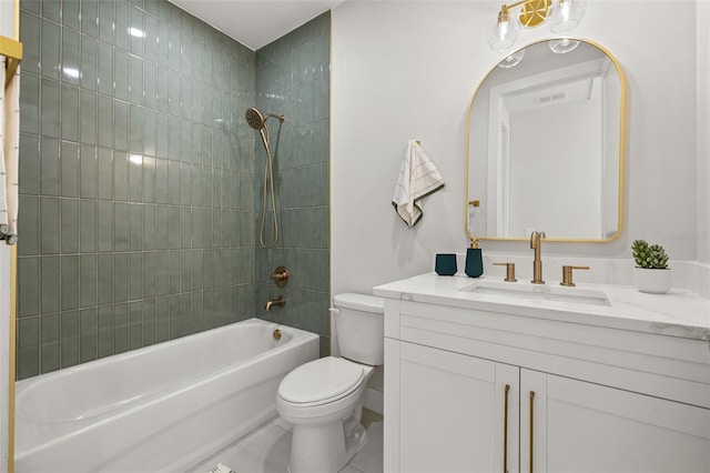 full bathroom featuring vanity, toilet, tiled shower / bath, and tile patterned floors