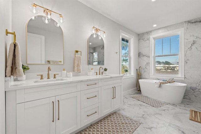 bathroom featuring a tub and vanity