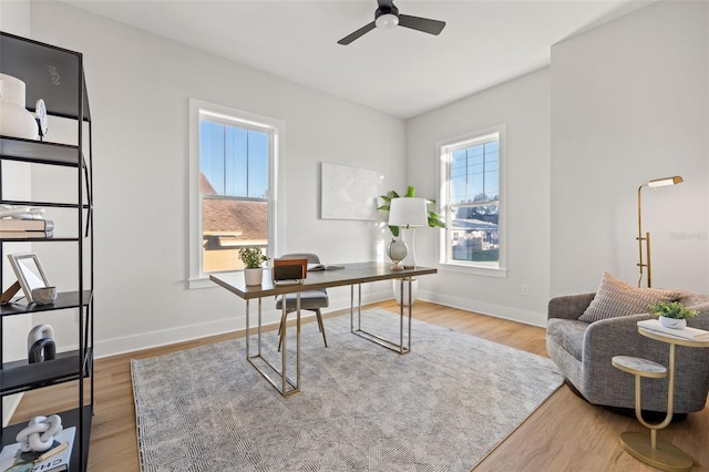 office space with hardwood / wood-style floors and ceiling fan