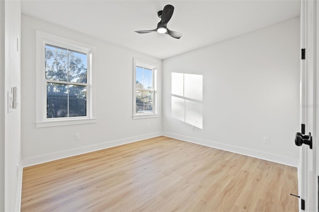 spare room featuring ceiling fan and light wood-type flooring