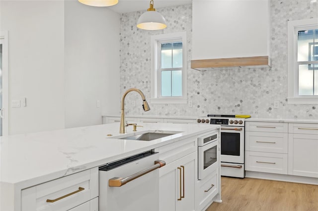 kitchen with sink, decorative light fixtures, white cabinetry, dishwasher, and white range with electric cooktop