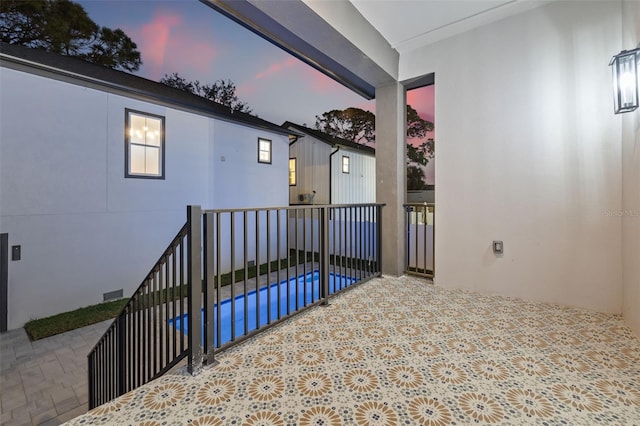 view of patio terrace at dusk