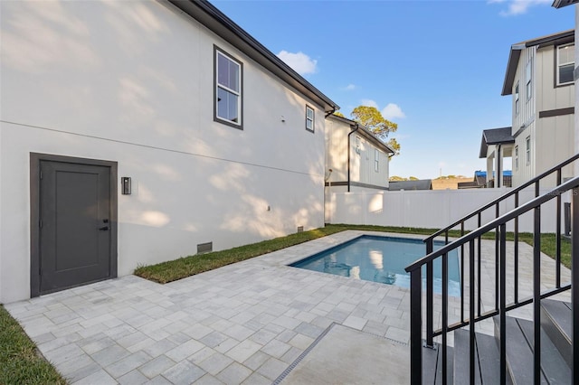 view of swimming pool featuring a patio area